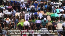 Palestinians pray outside Jerusalem's Lions Gate for 5th day