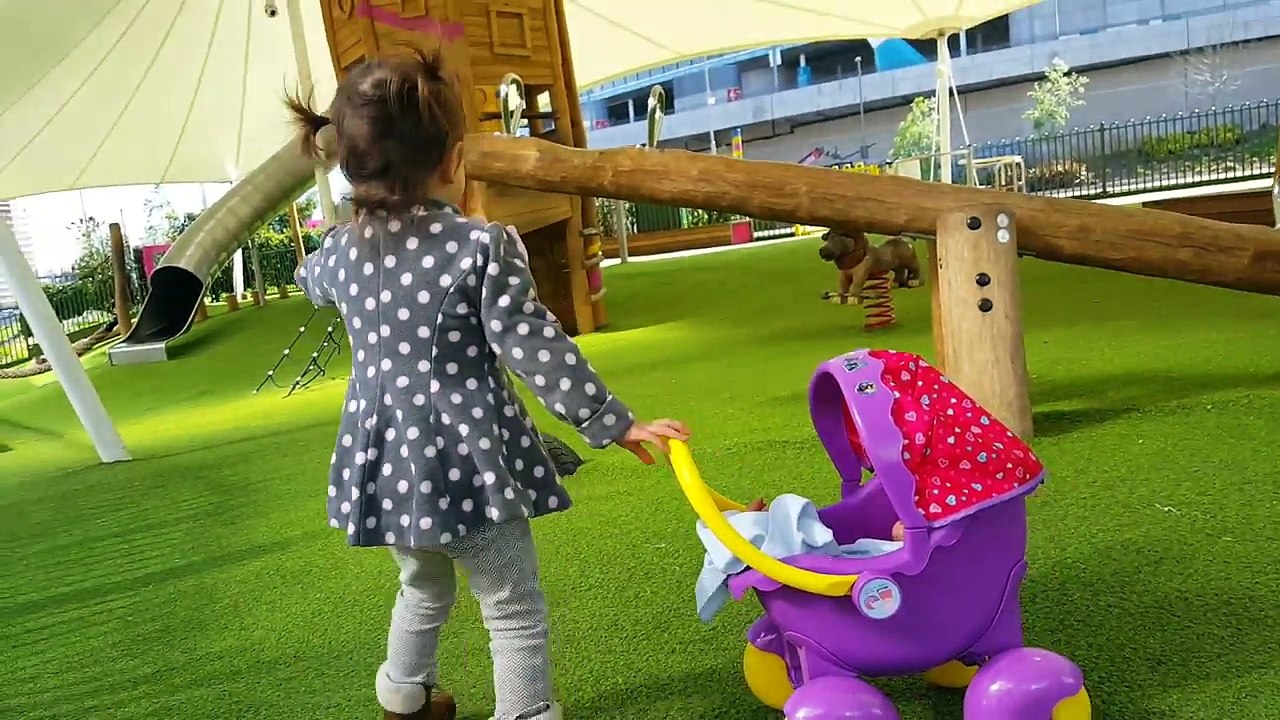 Little Girl Pushing Peppa Pig Stroller / Playground / Having Fun with Baby Doll