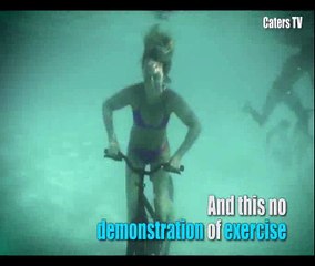 Activist model rides bike underwater for climate change