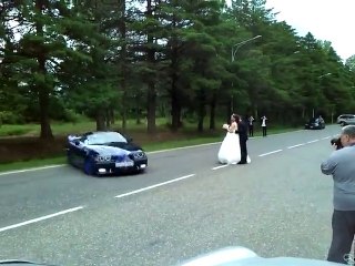 Car drifts around newly married couple