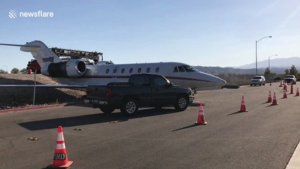 Jet aircraft rolls through fence at US airport