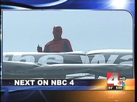 Human Rights Activist Donald Tenn Climbs down from Crane protest