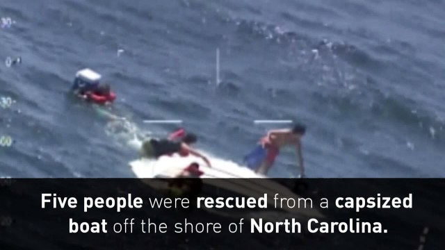 Coast Guard rescues five from capsized boat