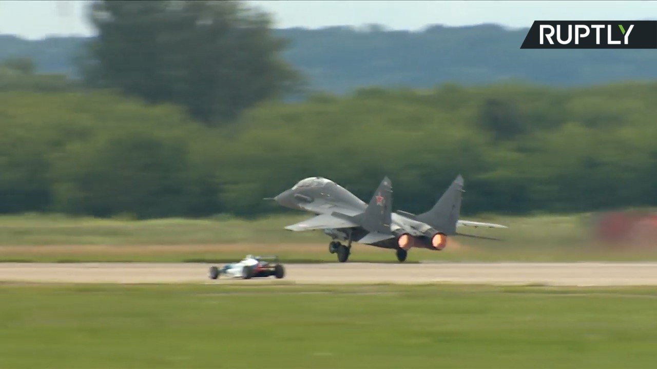 Formula 1 Race Car Takes On Fighter Jet in Epic Drag Race