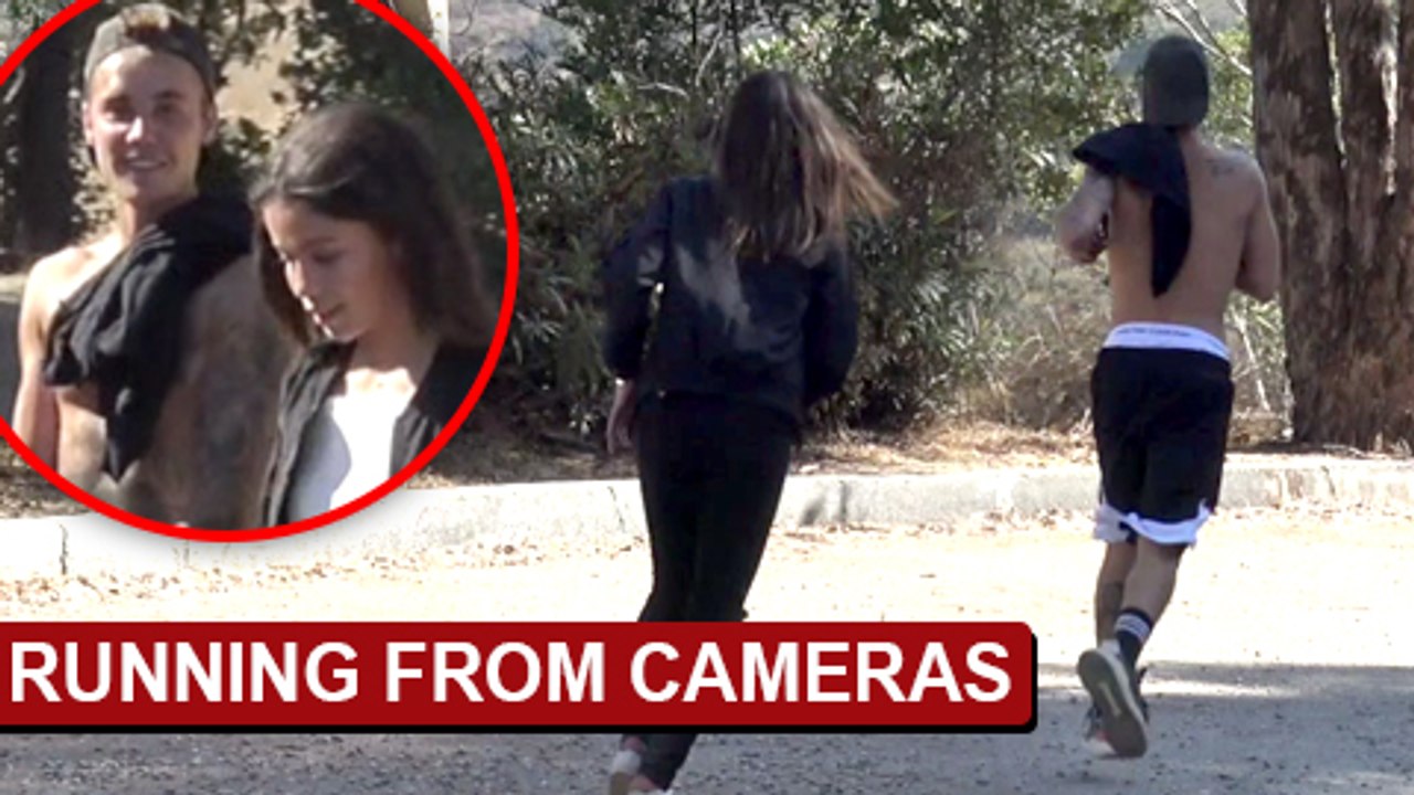Shirtless Justin Bieber Runs From Paparazzi With Mystery Girl In Los Angeles CA