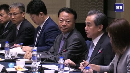 China urges ASEAN to reject outside interference
