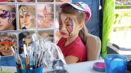 Funny trip with kids. Face paiting and outdoor playground