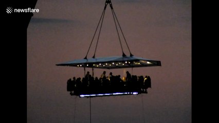 Diners suspended from a crane over South West London