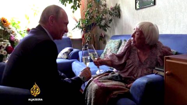Russian human rights leader gets surprise birthday visit from Putin