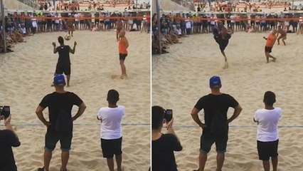 Ronaldinho Performs A Football Trick During A Volleyball Match