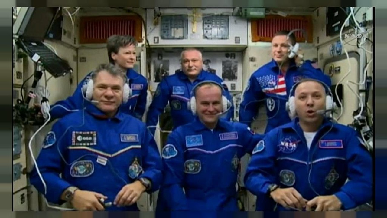 Astronauts safely join ISS