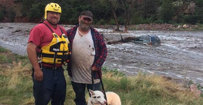 Man and Dog Rescued From Submerged Vehicle During Flash Flooding