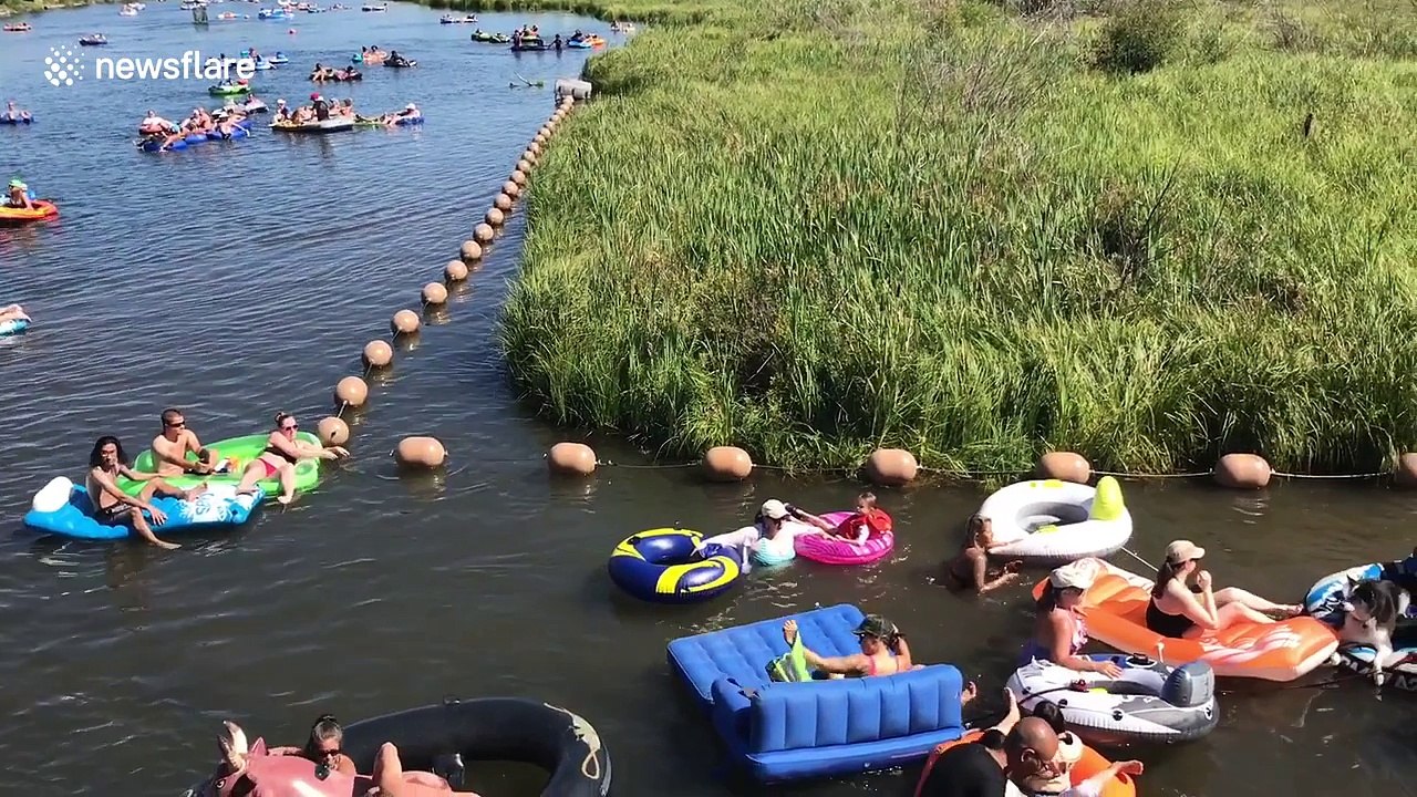 Hundreds float down river in dinghies during US heat wave