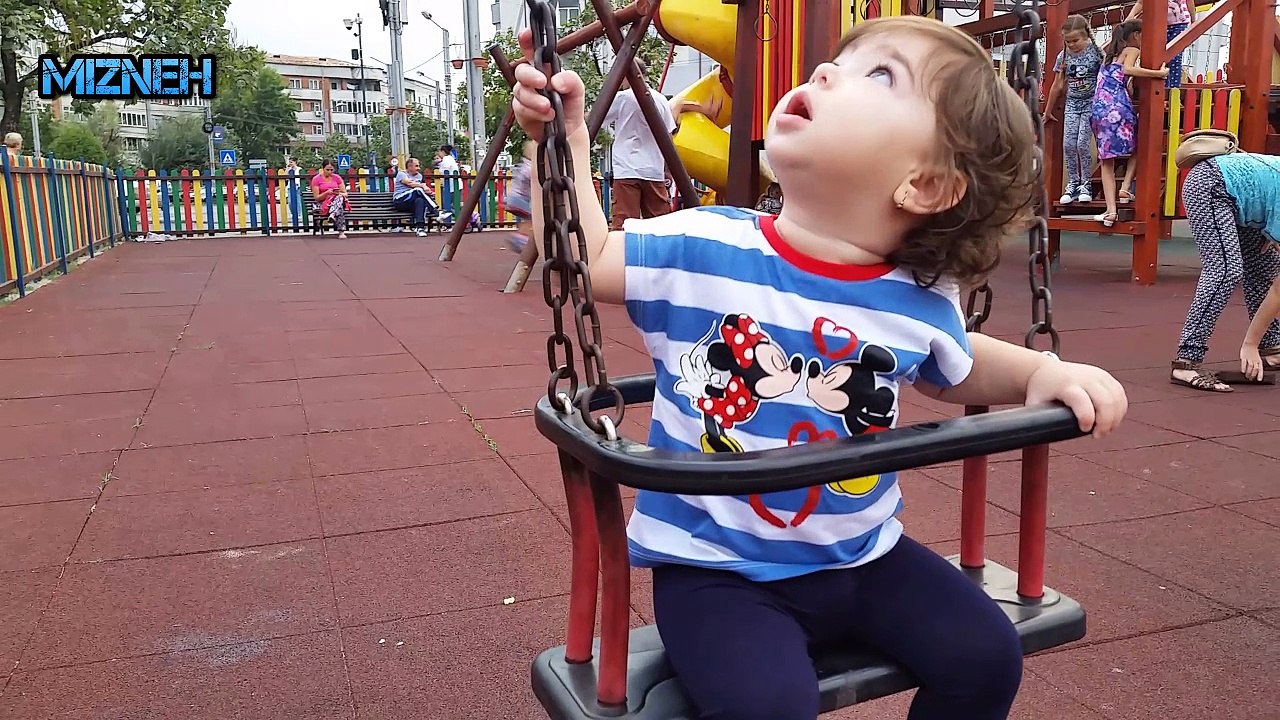 BABY MIZN DISCOVERS THE SWING AT THE PLAYGROUND