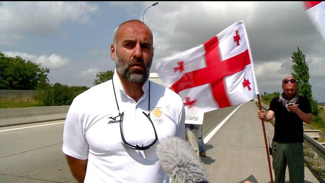 Georgians split over NATO bid amid rival protests over Russian occupation