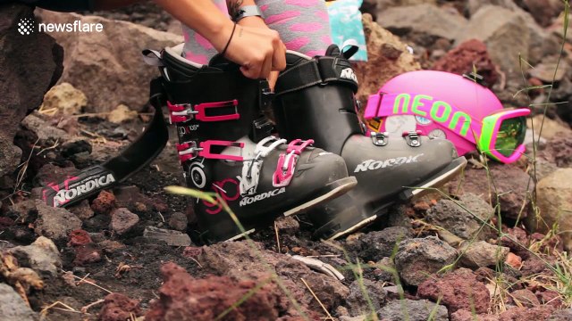 Women go sand skiing on the flanks of Mount Etna