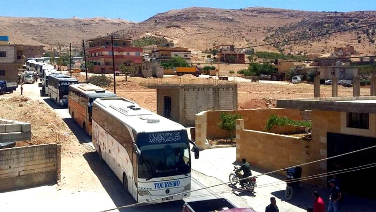 Syrian fighters, refugees leave Lebanon border area after Hezbollah truce