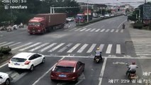 Scooter rider narrowly escapes being run over by lorry