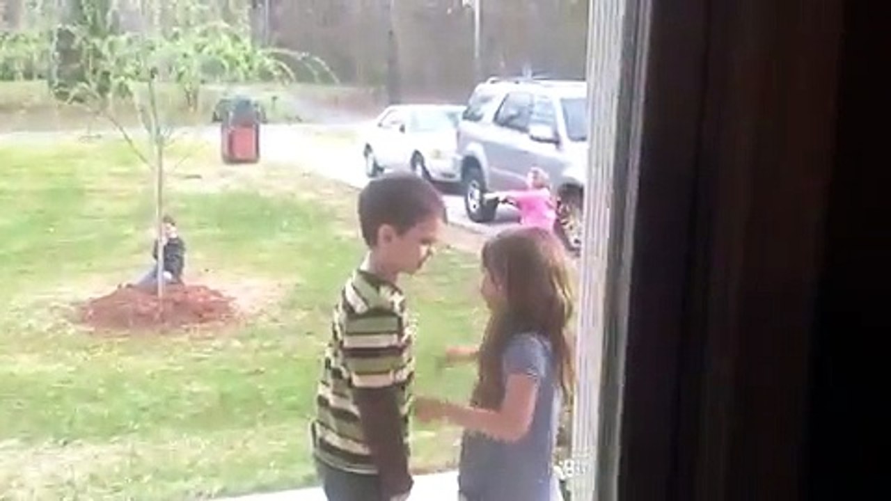 Little girl pulls little boy in for kisses before they se...
