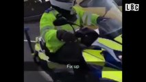 Biker Smacks Police Officer Over The Head On Busy Motorway