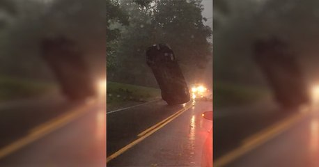 How In The Heck Did This Car Get Stuck Completely Upright On The Road