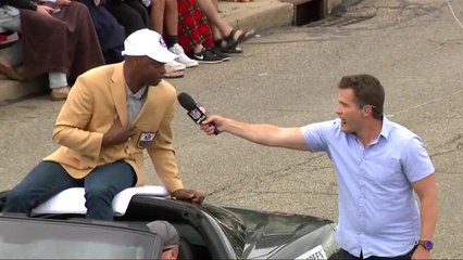 Darrell Green stops mid-parade to talk with Good Morning Football crew