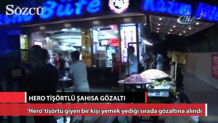 ‘Hero’ tişörtü giyen bir kişi yemek yediği sırada gözaltına alındı