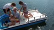 dji spark on lake fly over boat