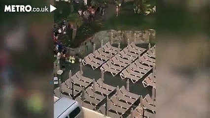 Tourist sprinting fast to bag sunbeds