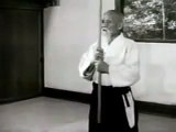 Morihei Ueshiba showing the basic movements of Jo and Ken in Aikido.