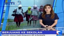 Para Siswa Ini Berjuang Lewati Tanah Berlumpur dan Alat Berat