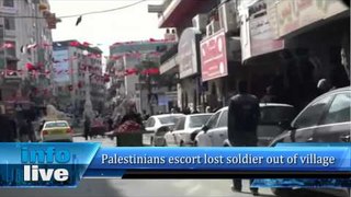 Palestinians escort lost soldier out of village