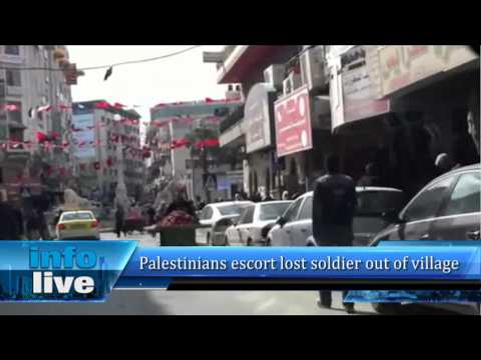 Palestinians escort lost soldier out of village