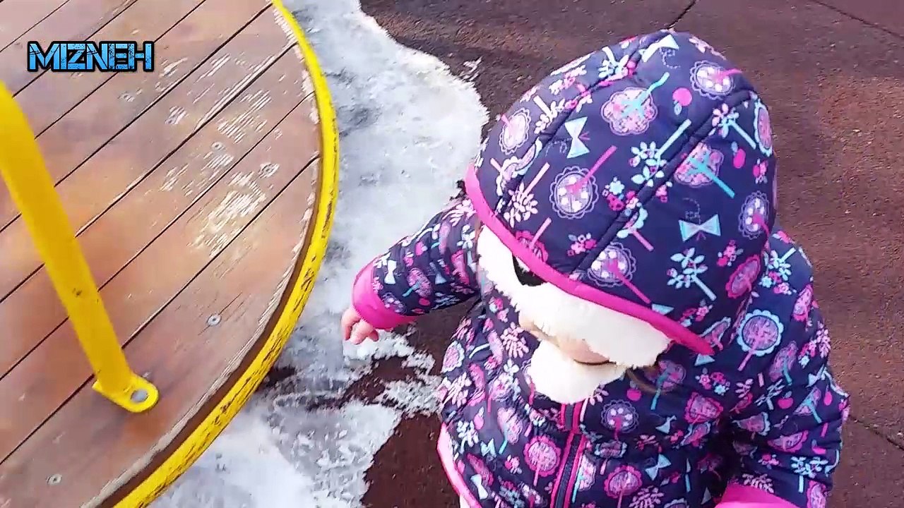 Baby meeting other baby on a cold day
