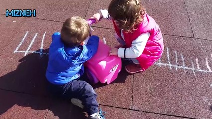 Children sharing toys at the playground