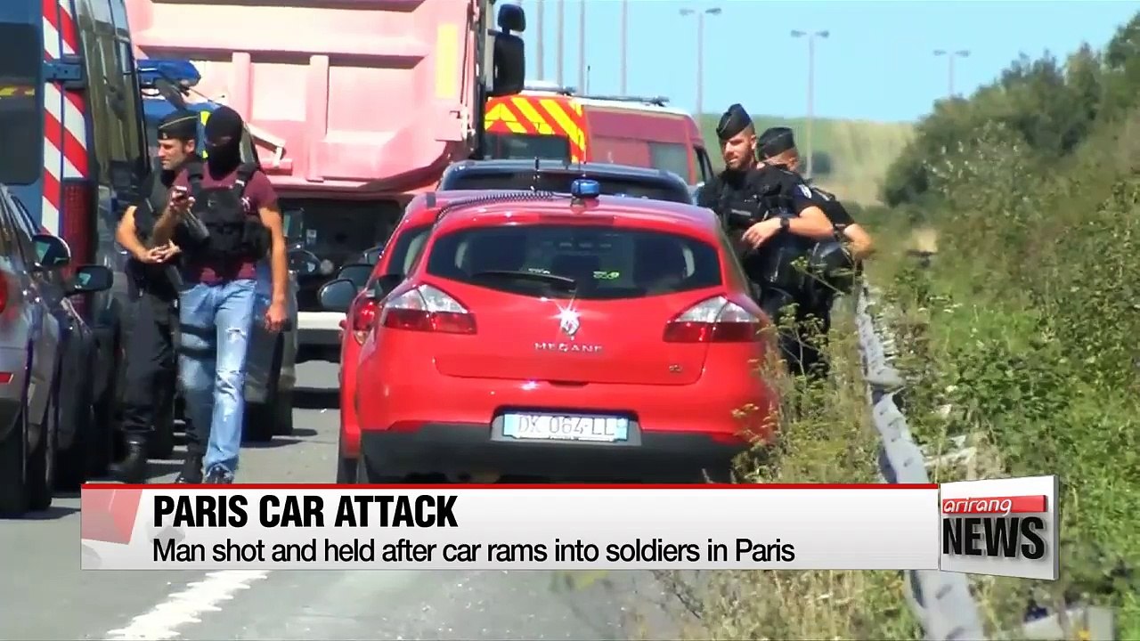Man shot and held after car rams into soldiers in Paris