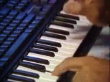 Asian Guy Plays Drums On A Keyboard