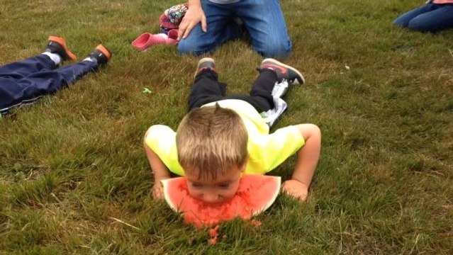 Kid Uses His Head In Watermelon Contest