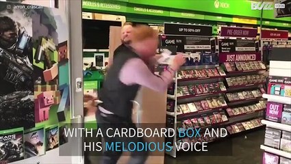 Arron Crascall scares people in the street with a cardboard box