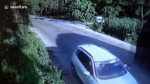 Car narrowly escapes being crushed when truck flips