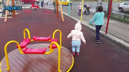 Babies sharing time playing