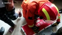 Firefighters rescue girl stuck in wall gap