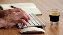 Free HD Stock Video Footage - Man Typing On Wireless Mac Keyboard