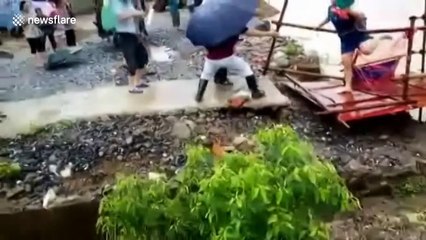 Foot bridge collapses moments after woman crosses it