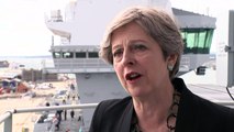 May urges political leaders to condemn far-right views