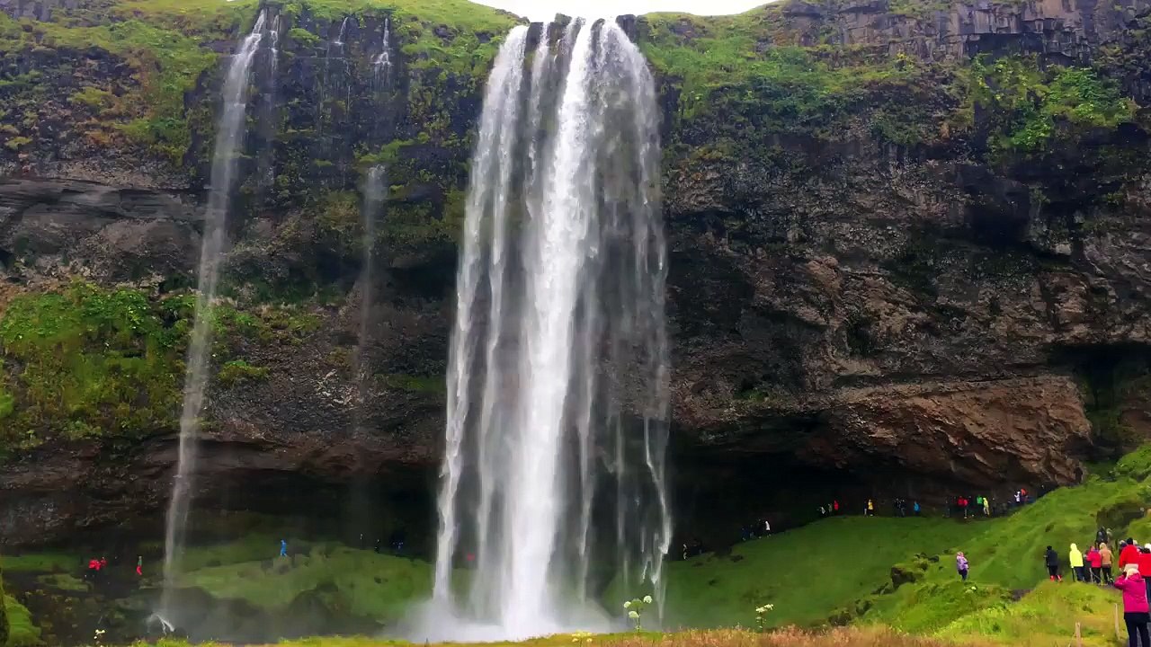 A waterfall is a place where water flows over a vertical drop or a series of drops in the course of