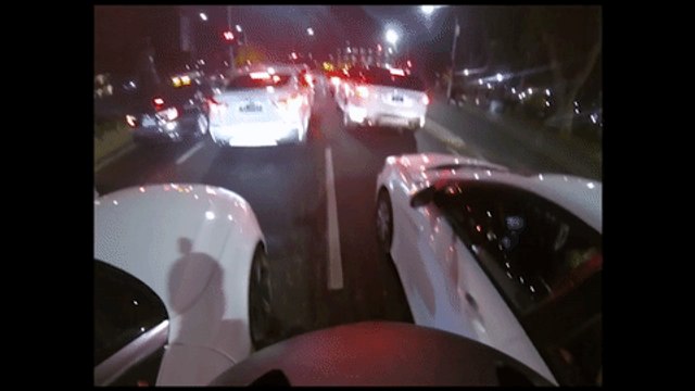 Cyclist Throws Back Audi Owner's Litter Into Open Convertible