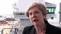 Theresa May criticises Trump for his failure to condemn white supremacists