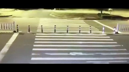 Scooter drives straight into giant sinkhole in China