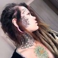Pretty girl shows her face and neck tattoos